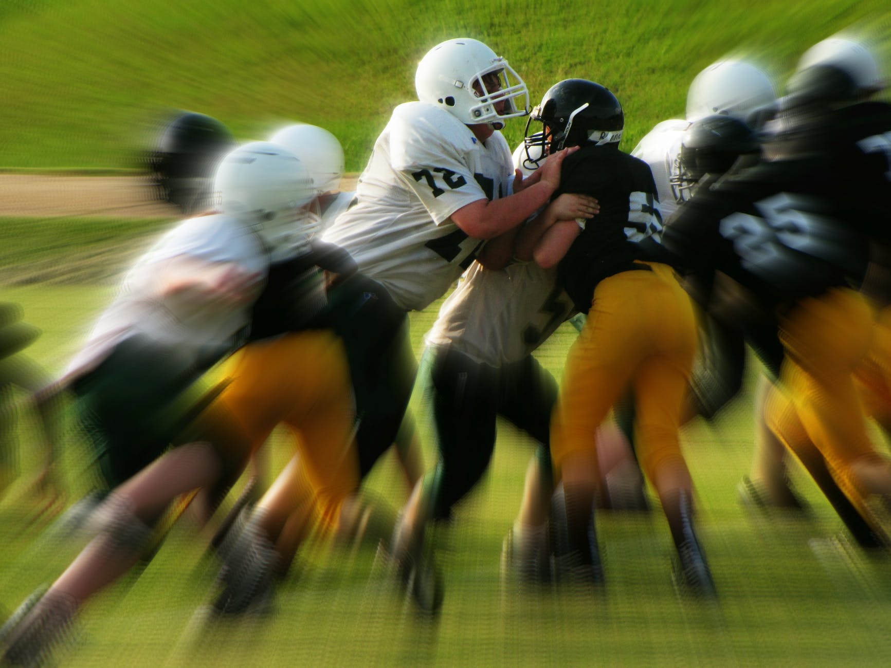 men in white and black playing football